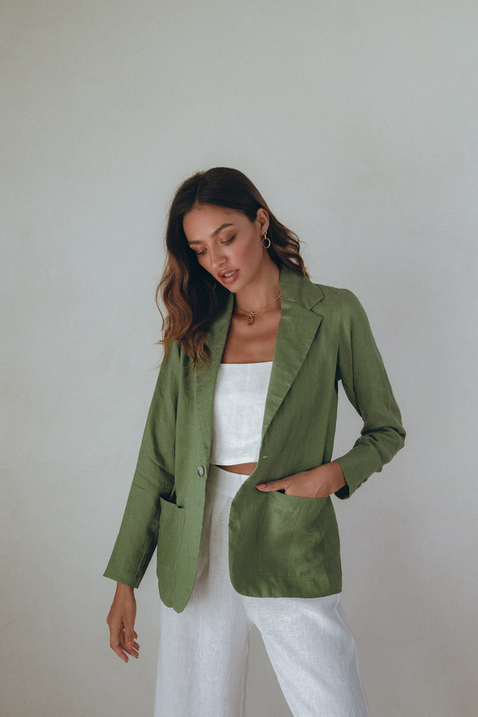 model wearing green linen cotton blazer